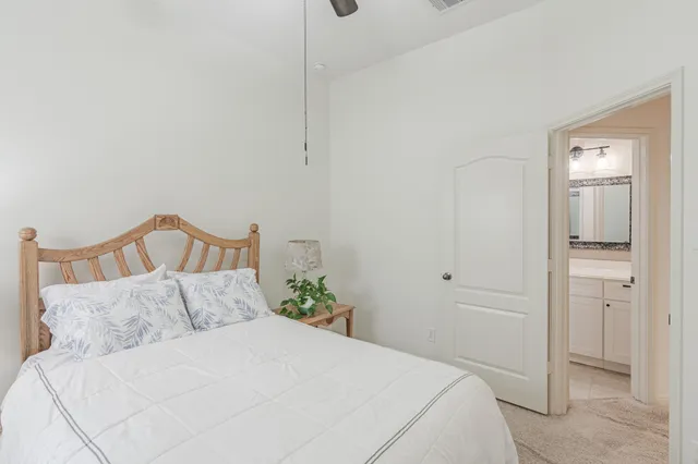 a bedroom with a bed and a mirror