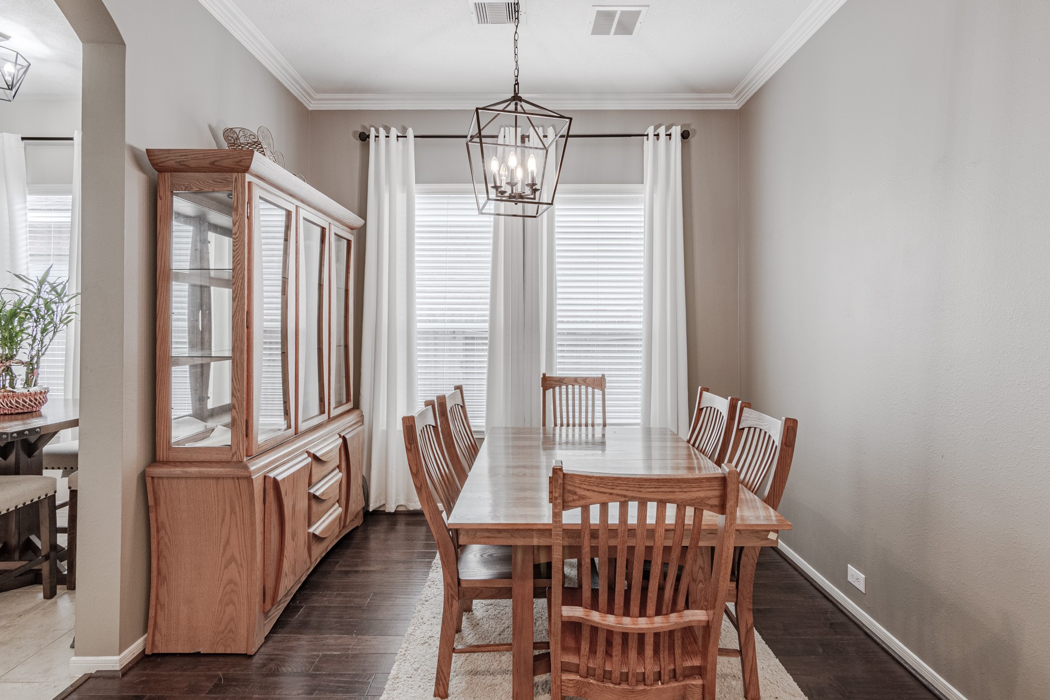 2954 Smokey Forest Lane Spring, TX 77386 - Photo 7 of 40 a view of a dining room with furniture a chandelier and wooden floor