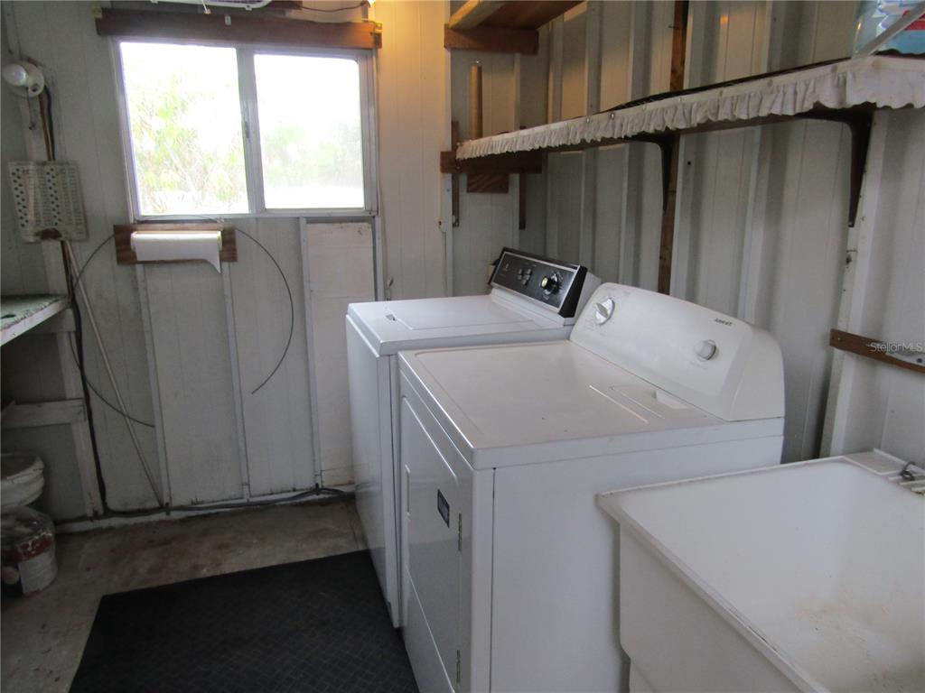 721 Roma Road Venice, FL 34285 - Photo 12 of 20 a utility room with dryer and washer