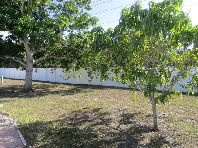 a view of swimming pool with outdoor seating and plants