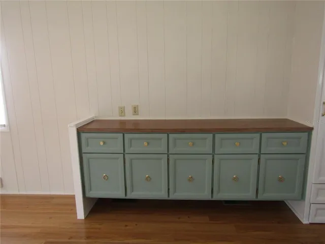 a view of a cabinets and wooden floor