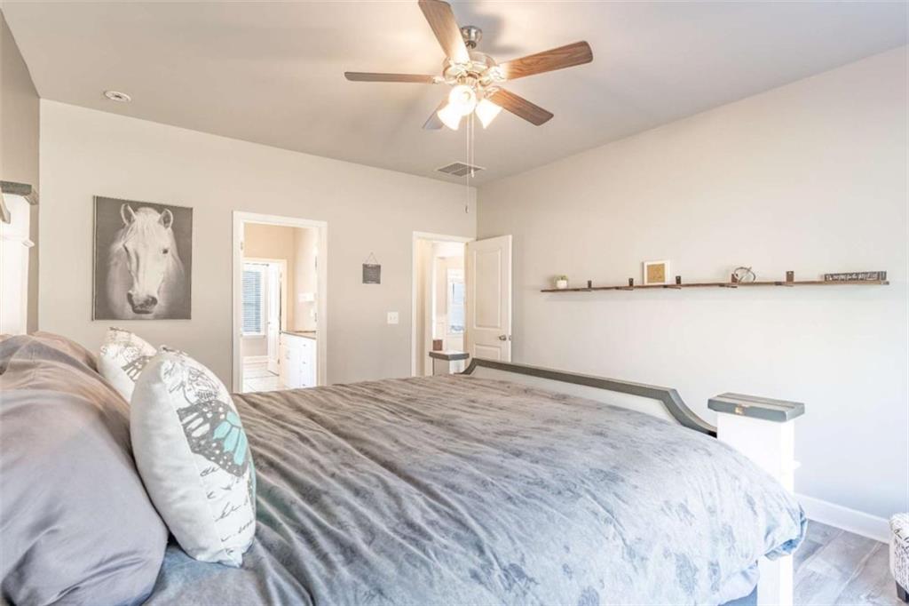 35 Hawthorn Lane Covington, GA 30014 - Photo 17 of 38 a bedroom with a bed and ceiling fan