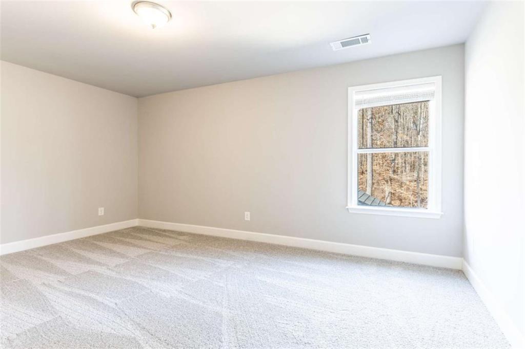 35 Hawthorn Lane Covington, GA 30014 - Photo 27 of 38 an empty room with a window
