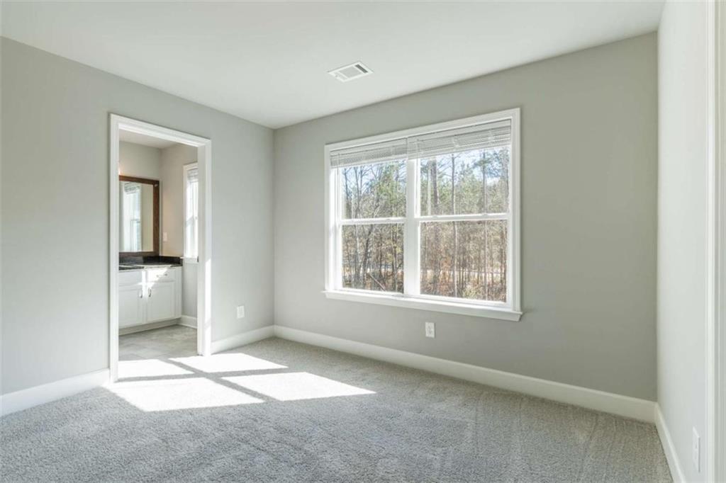 35 Hawthorn Lane Covington, GA 30014 - Photo 30 of 38 an empty room with a empty space and windows
