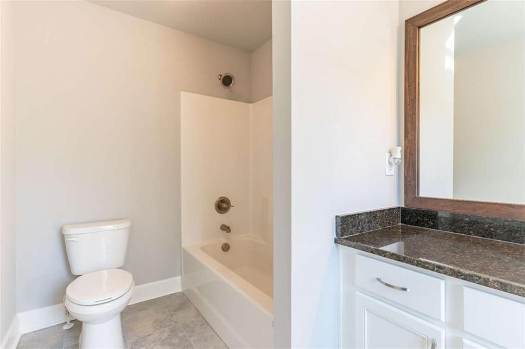 35 Hawthorn Lane Covington, GA 30014 - Photo 33 of 38 a bathroom with a granite countertop sink toilet and bathtub