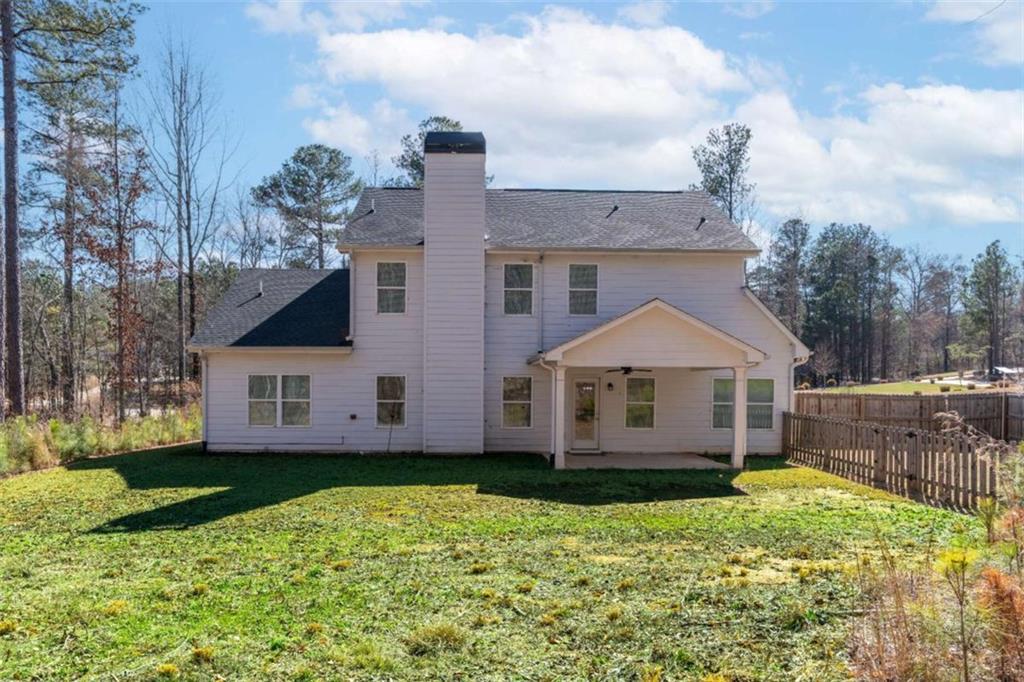 35 Hawthorn Lane Covington, GA 30014 - Photo 35 of 38 a view of a house with a backyard