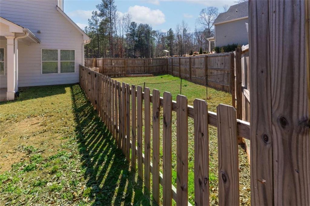 35 Hawthorn Lane Covington, GA 30014 - Photo 36 of 38 a view of deck and garden