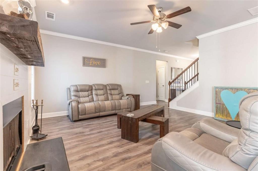 35 Hawthorn Lane Covington, GA 30014 - Photo 6 of 38 a living room with furniture and a fireplace