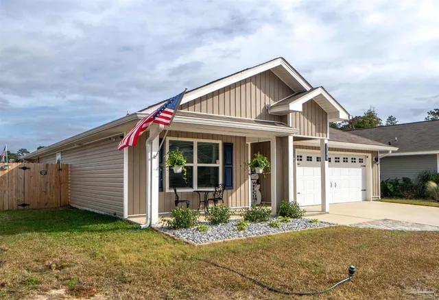 a view of house with yard
