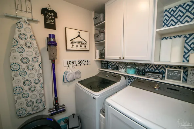 a utility room with dryer and washer