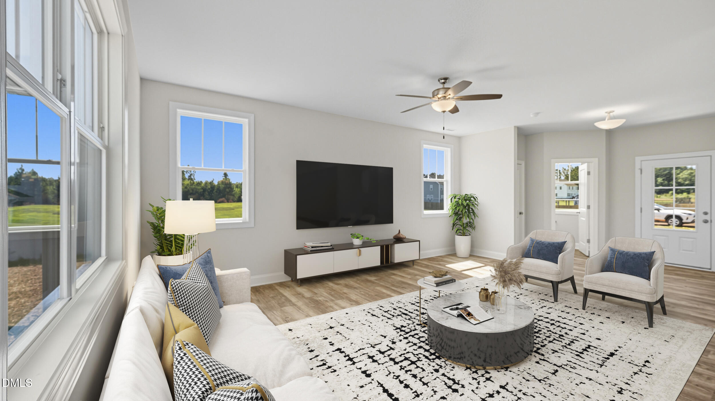 4105 Ralph Holt Court Snow Camp, NC 27349 - Photo 12 of 35 a living room with furniture a rug and a flat screen tv