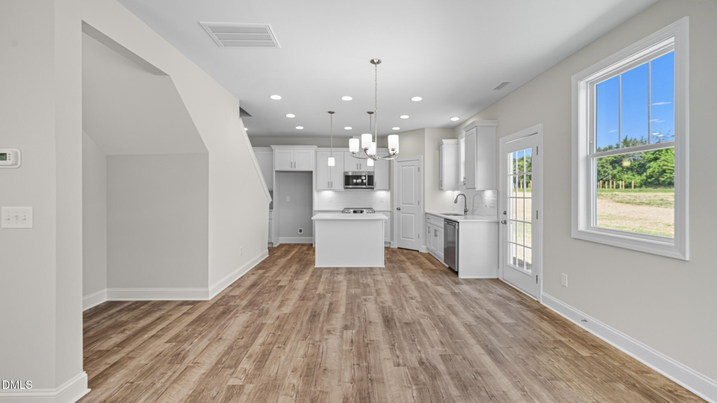 4105 Ralph Holt Court Snow Camp, NC 27349 - Photo 14 of 35 a view of a kitchen with wooden floor and windows