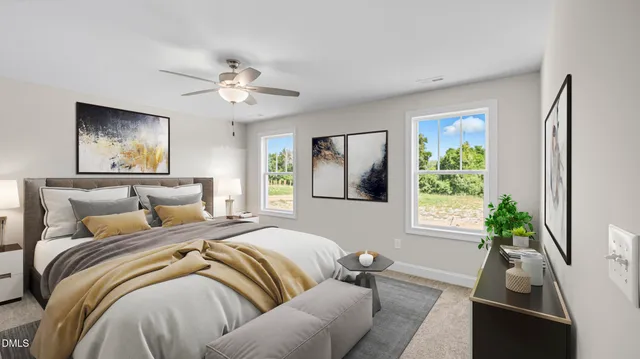 a bedroom with a bed couch and a window