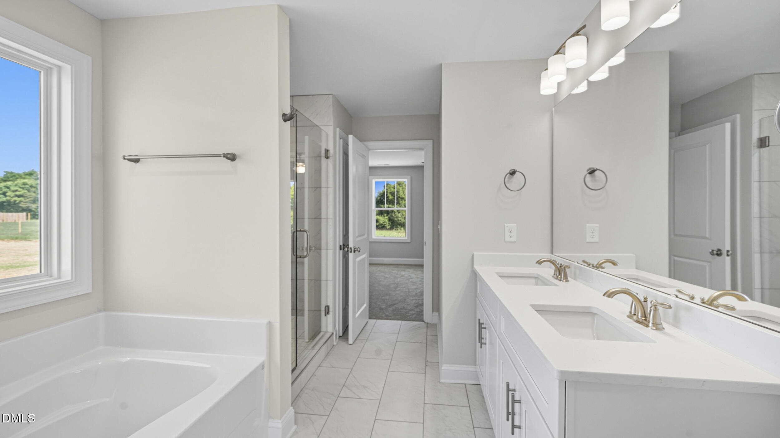 4105 Ralph Holt Court Snow Camp, NC 27349 - Photo 24 of 35 a bathroom with a tub sink shower and a mirror