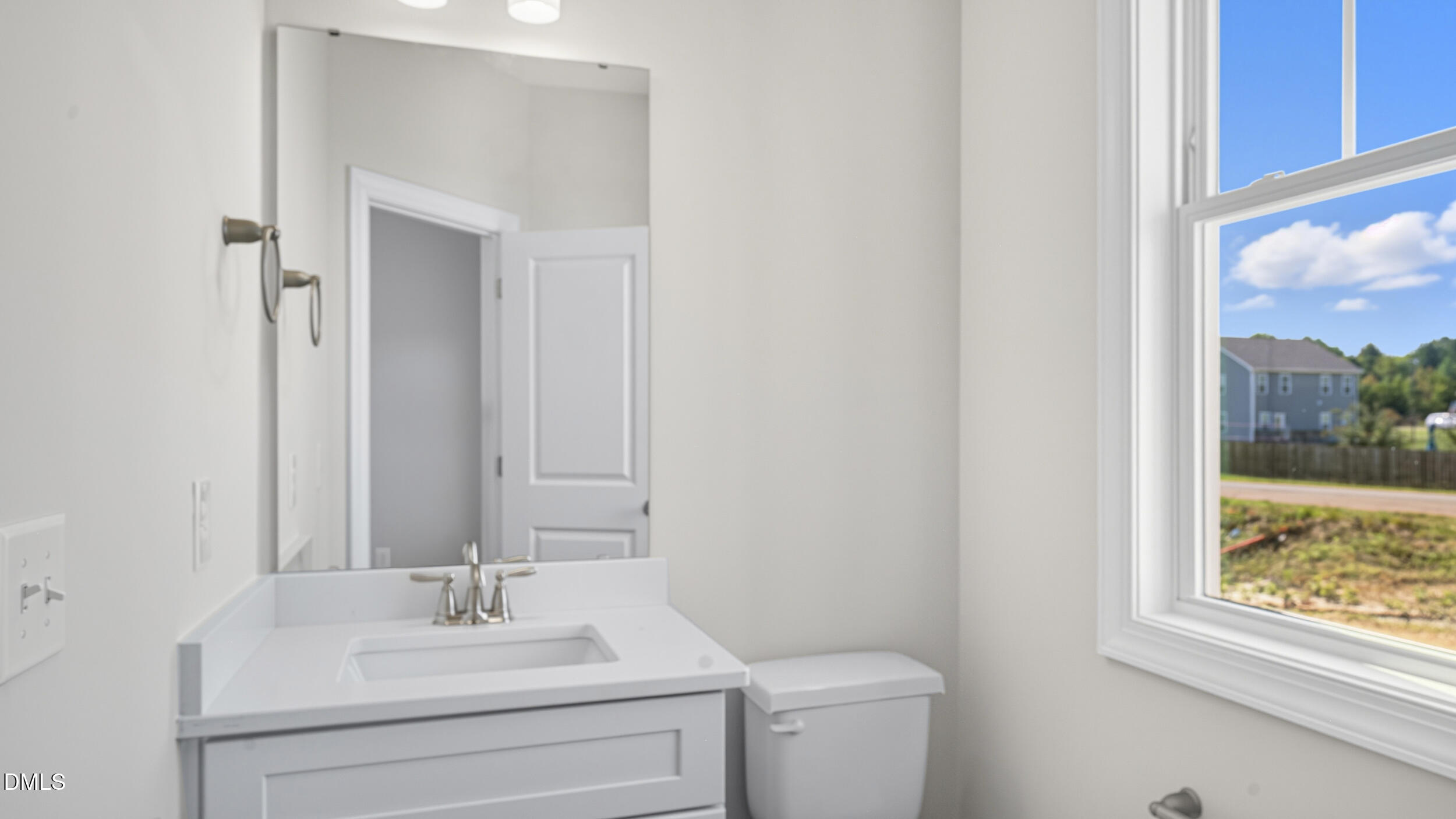 4105 Ralph Holt Court Snow Camp, NC 27349 - Photo 6 of 35 a bathroom with a sink vanity mirror and toilet