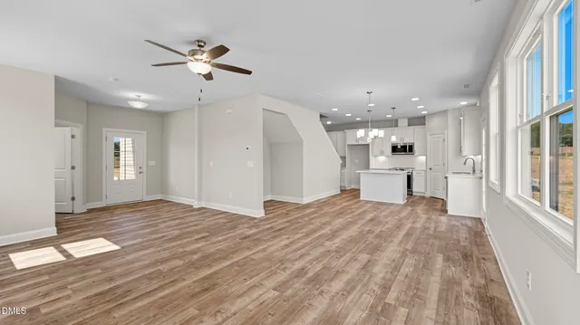 a view of a livingroom with a kitchen