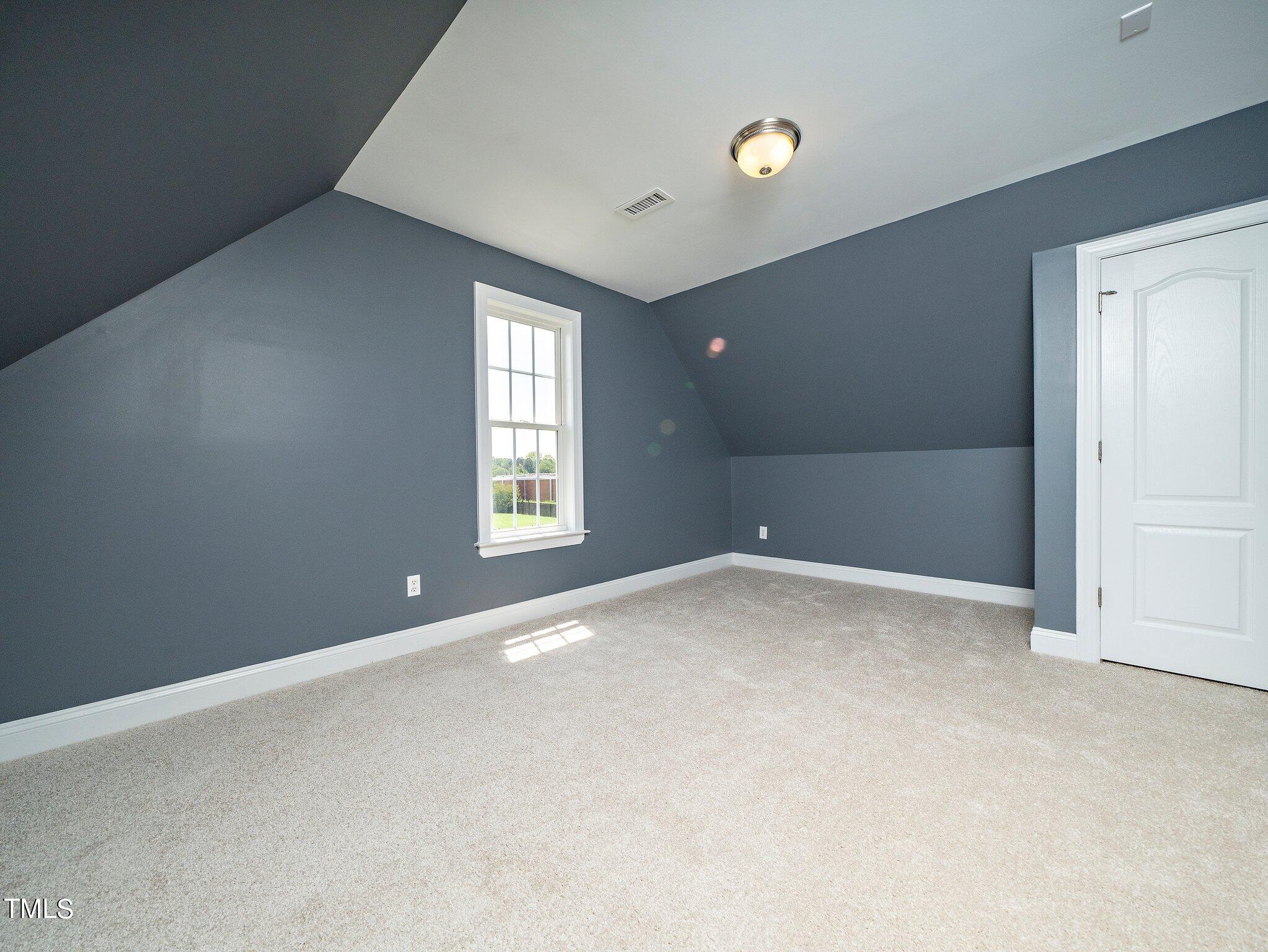 5004 Contender Drive Raleigh, NC 27603 - Photo 16 of 28 an empty room with windows and closet