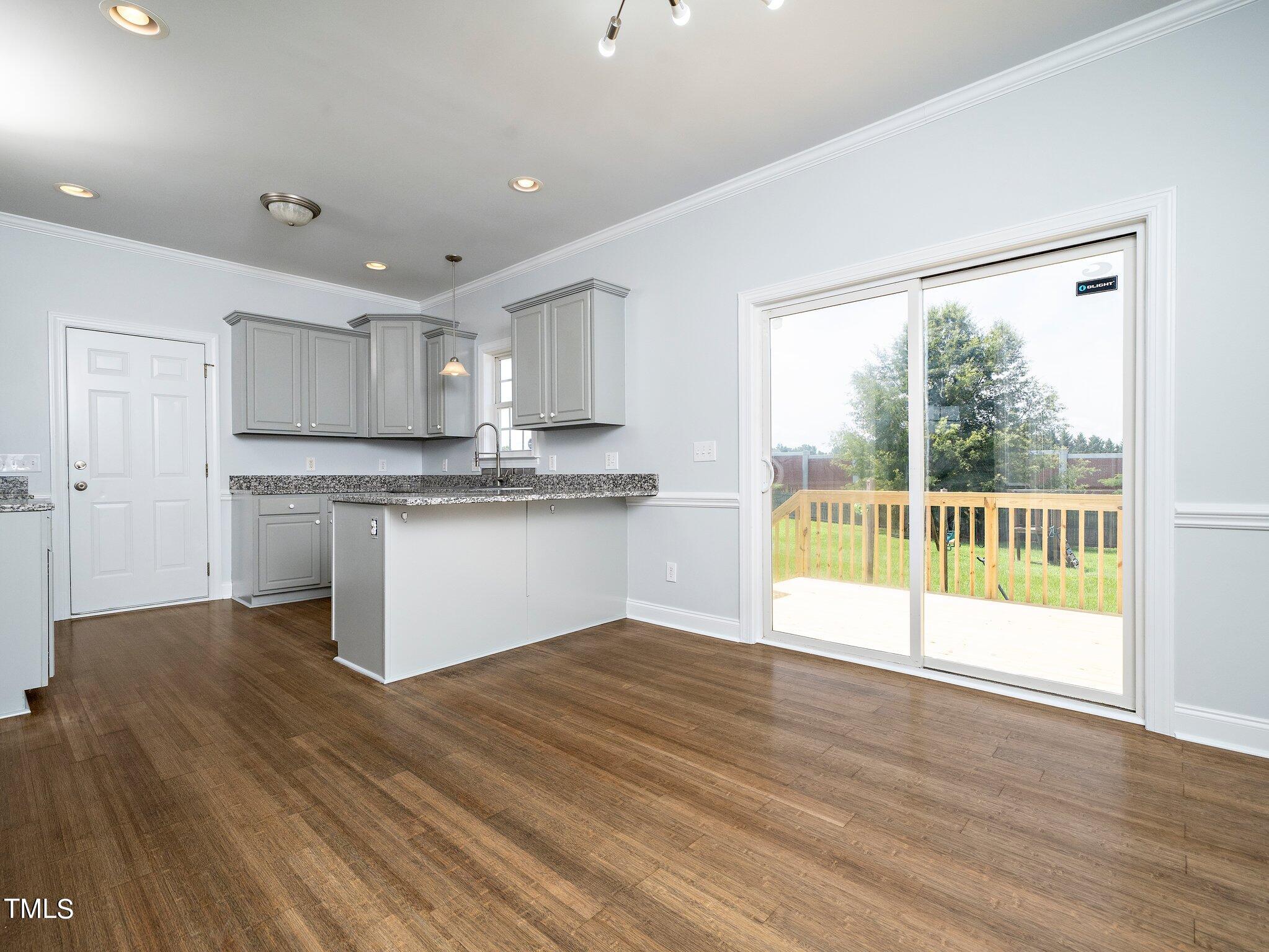 5004 Contender Drive Raleigh, NC 27603 - Photo 18 of 28 a view of a kitchen with a sink and a large window