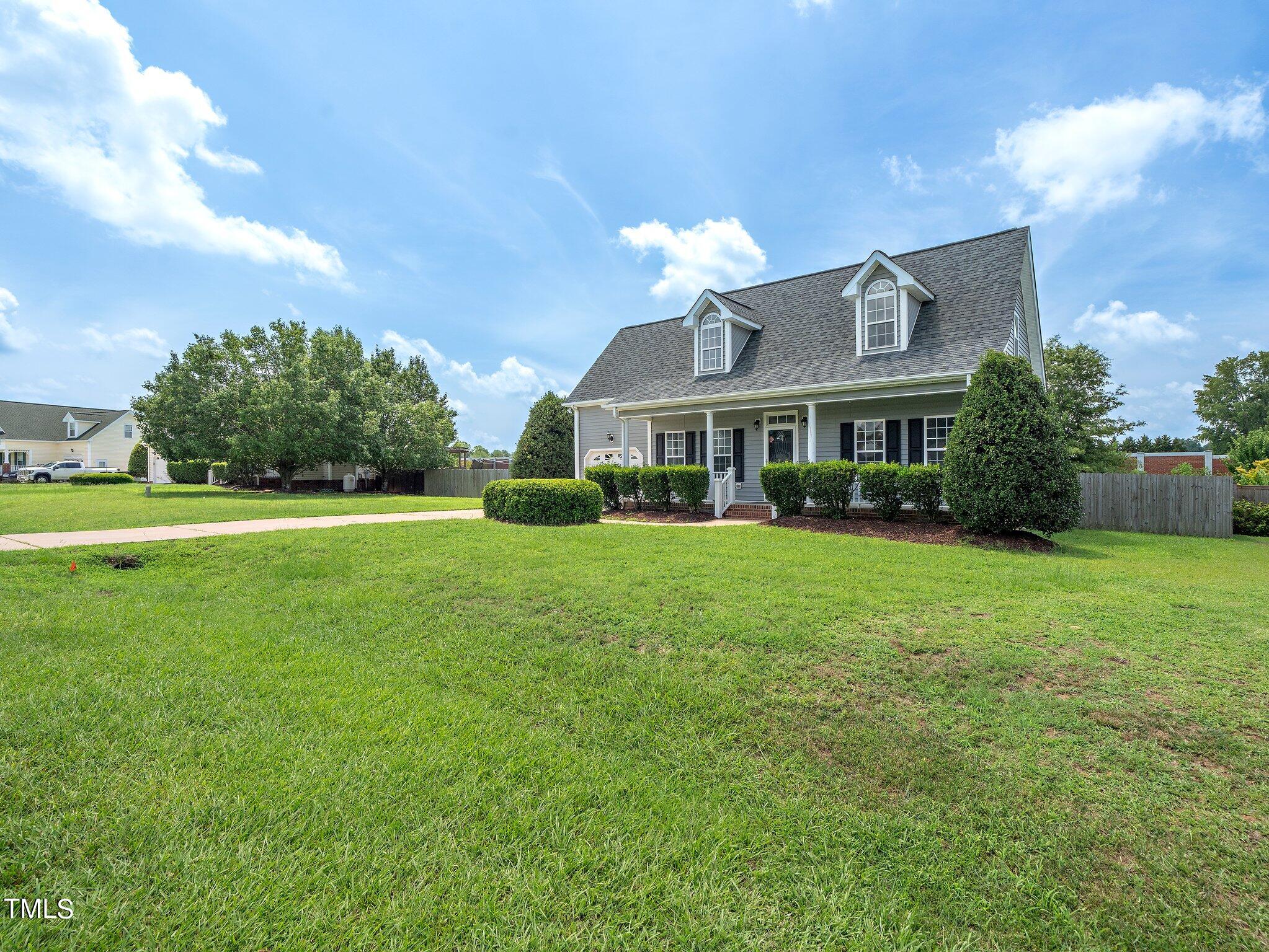 5004 Contender Drive Raleigh, NC 27603 - Photo 19 of 28 a front view of a house with garden