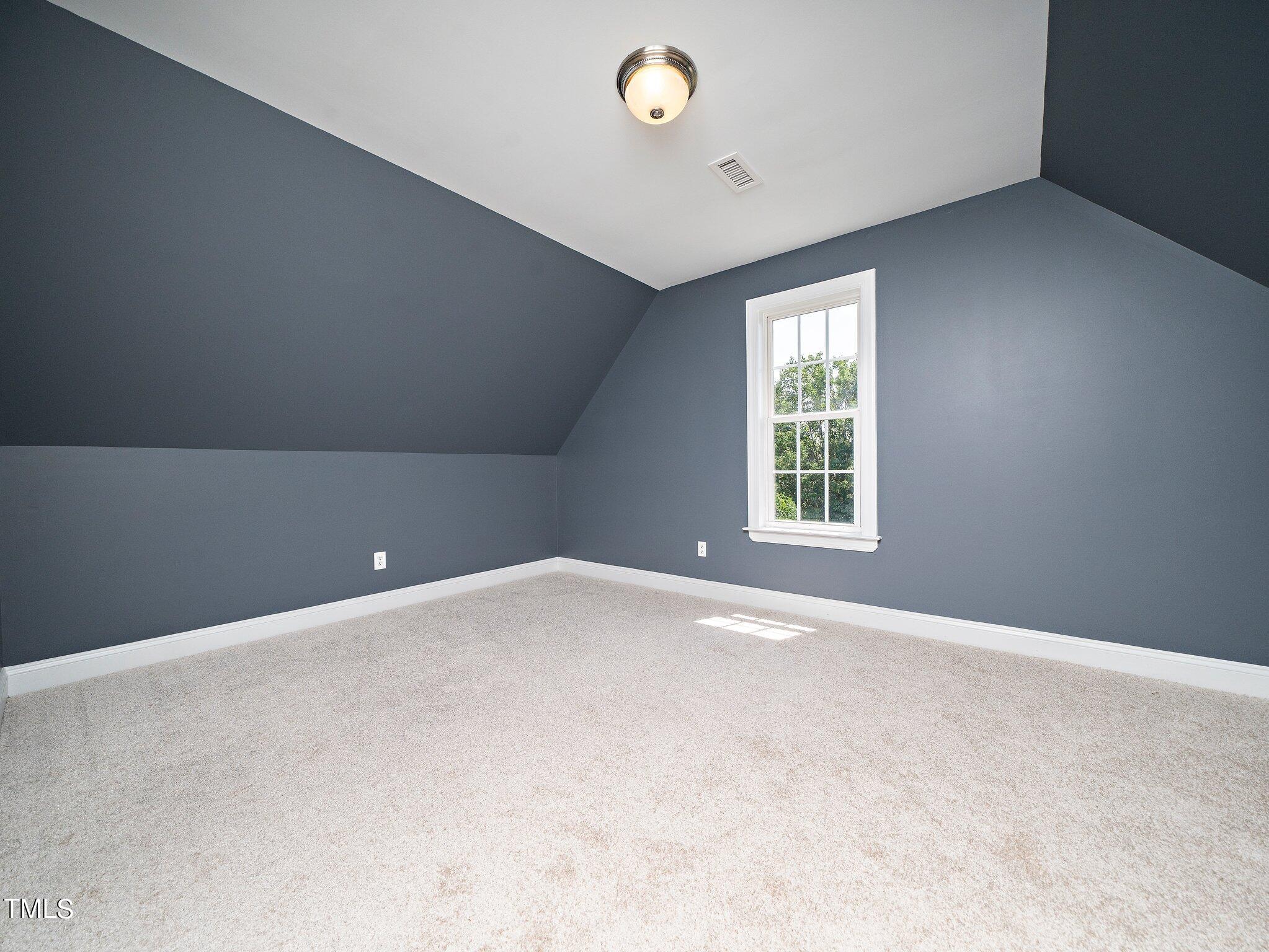 5004 Contender Drive Raleigh, NC 27603 - Photo 23 of 28 an empty room with windows