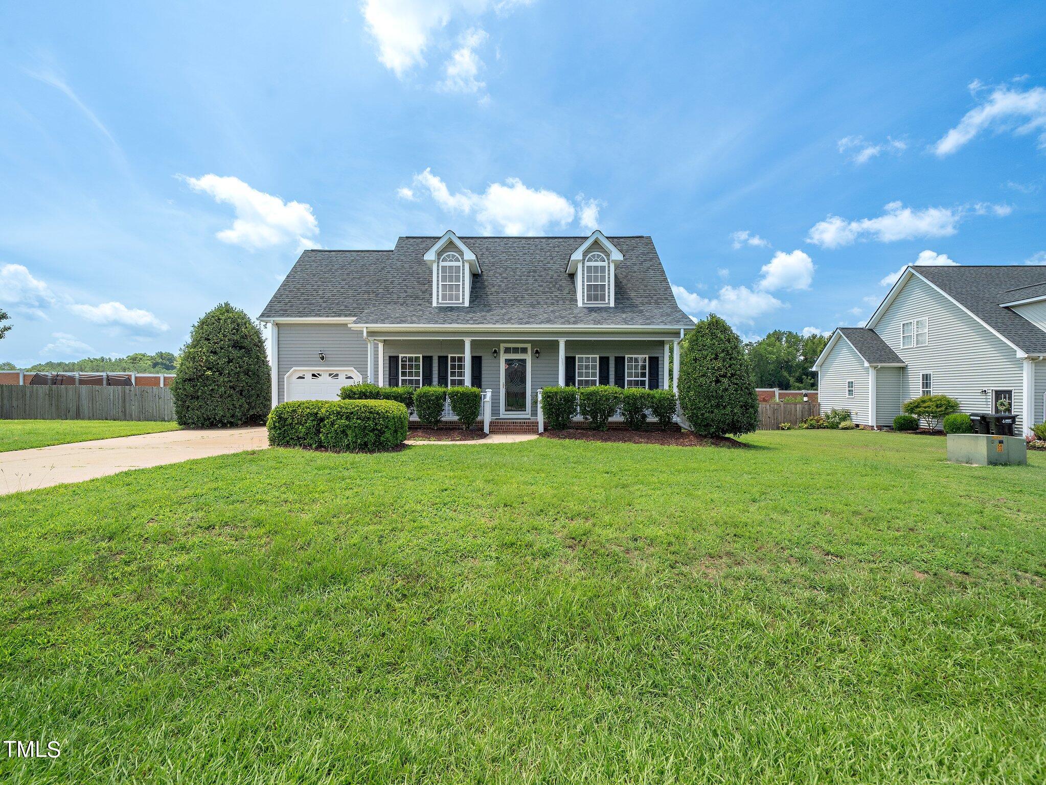 5004 Contender Drive Raleigh, NC 27603 - Photo 4 of 28 a view of a yard in front of the house