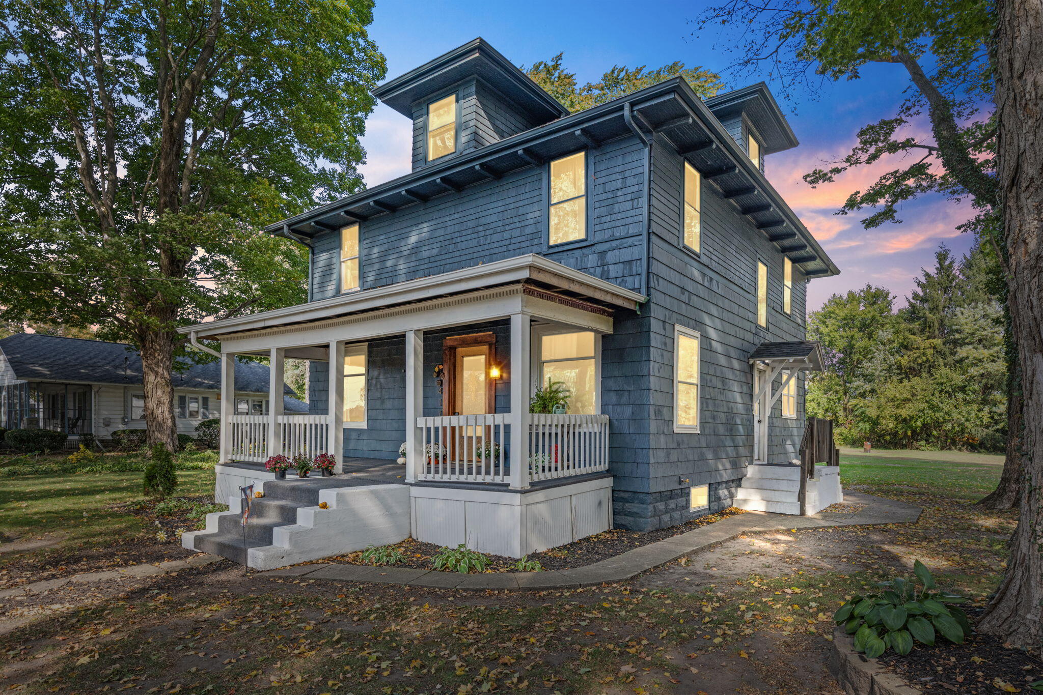 a front view of a house with garden