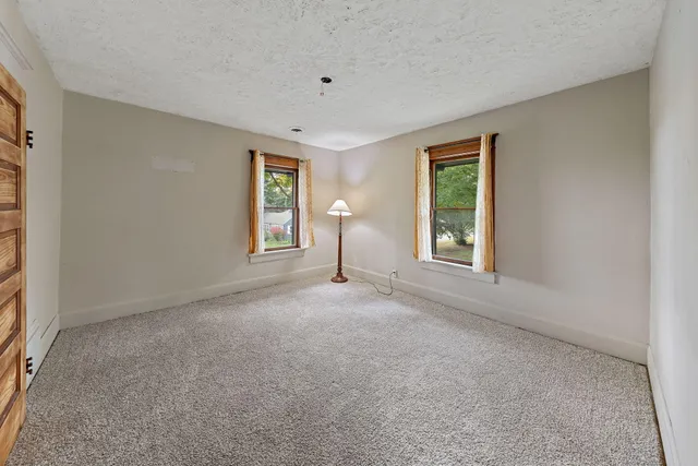 a view of empty room with windows