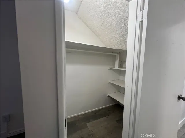 a view of an empty walk in closet