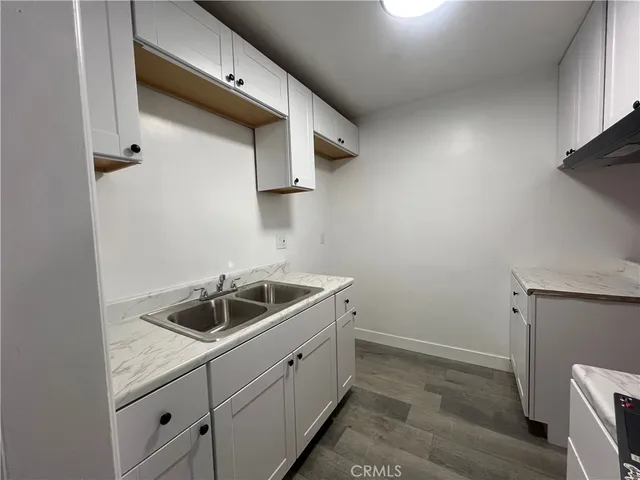 a kitchen with a sink and cabinets