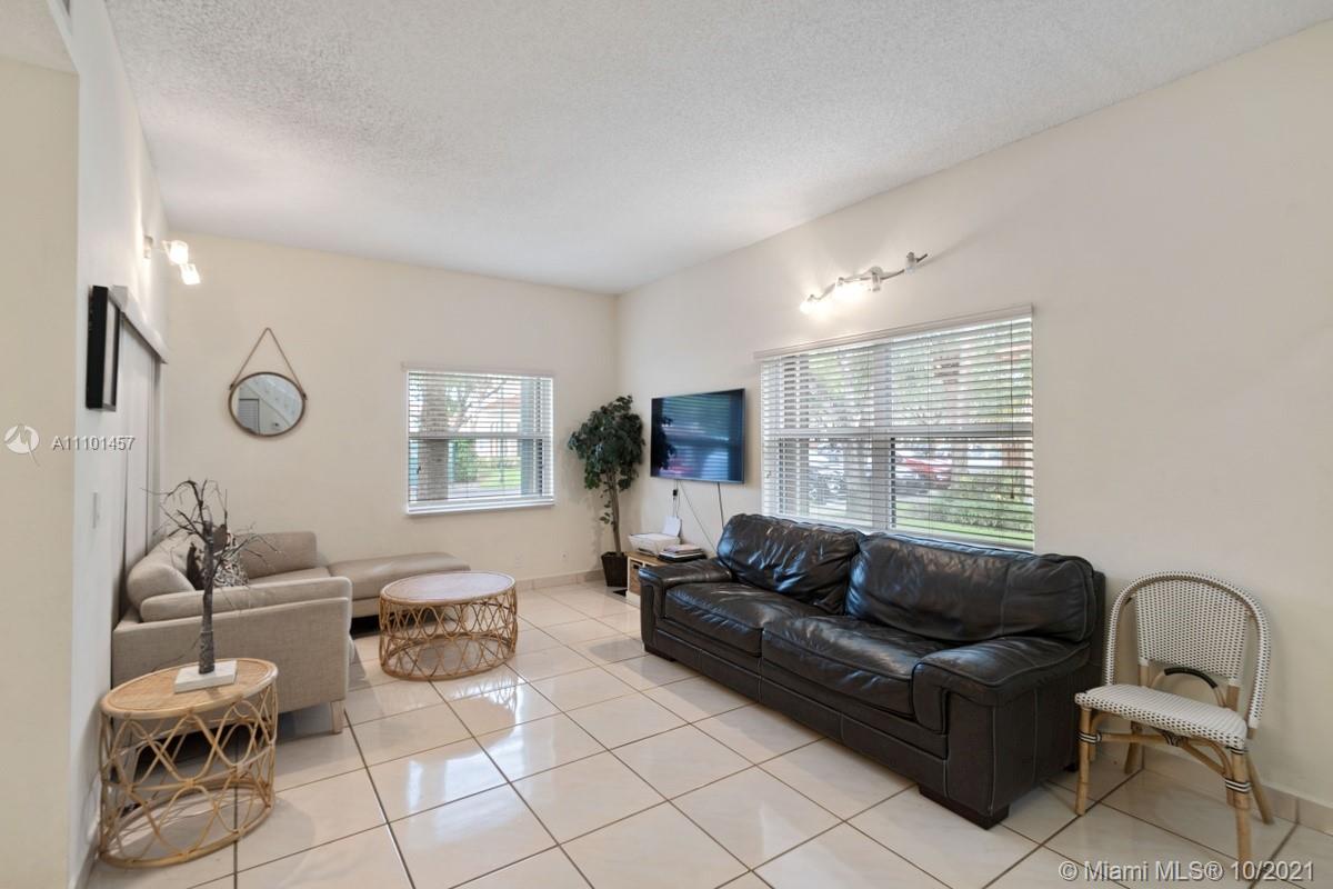 501 Racquet Club Road, Unit 61 Weston, FL 33326 - Photo 3 of 17 a living room with furniture and a window