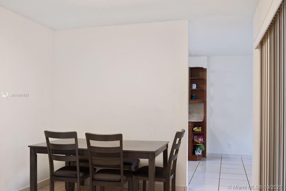 501 Racquet Club Road, Unit 61 Weston, FL 33326 - Photo 5 of 17 a view of a dining room with furniture