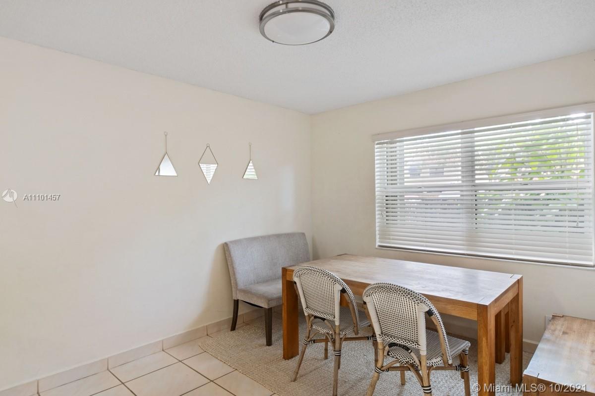 501 Racquet Club Road, Unit 61 Weston, FL 33326 - Photo 8 of 17 a view of a workspace with furniture and a window