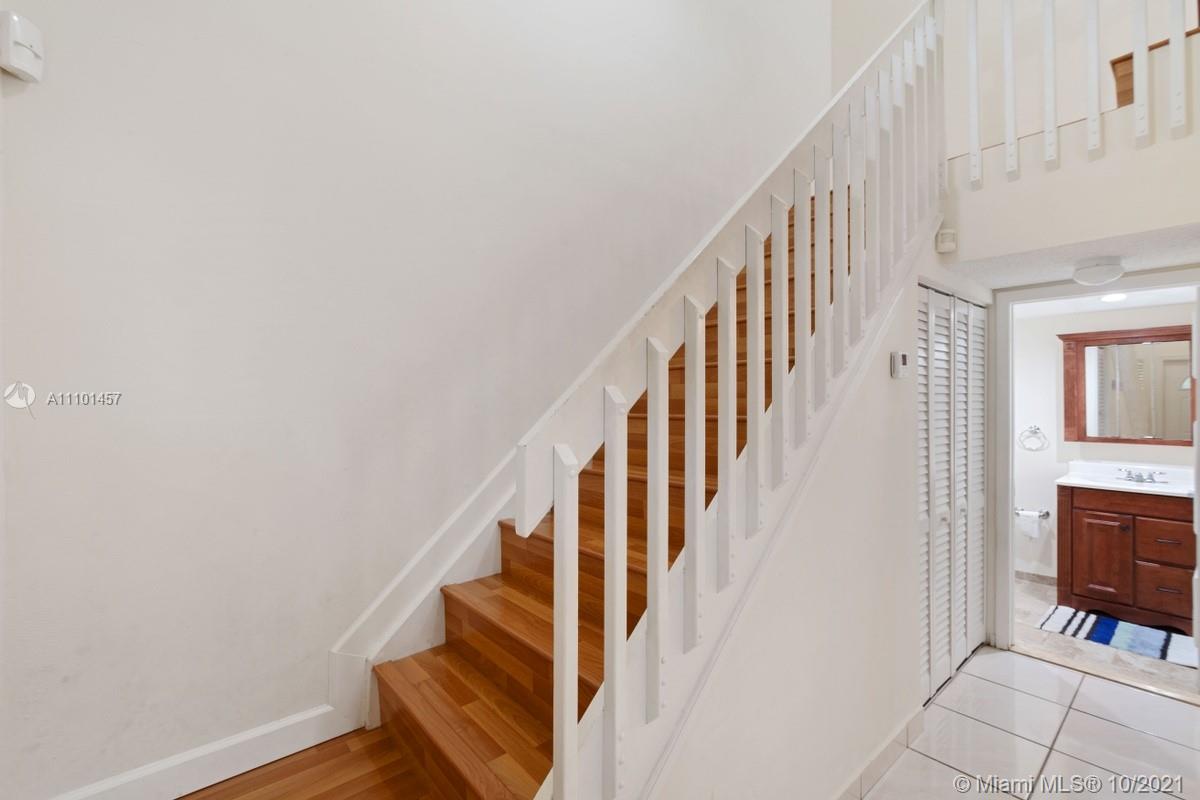 501 Racquet Club Road, Unit 61 Weston, FL 33326 - Photo 10 of 17 a view of entryway with stairs and wooden floor