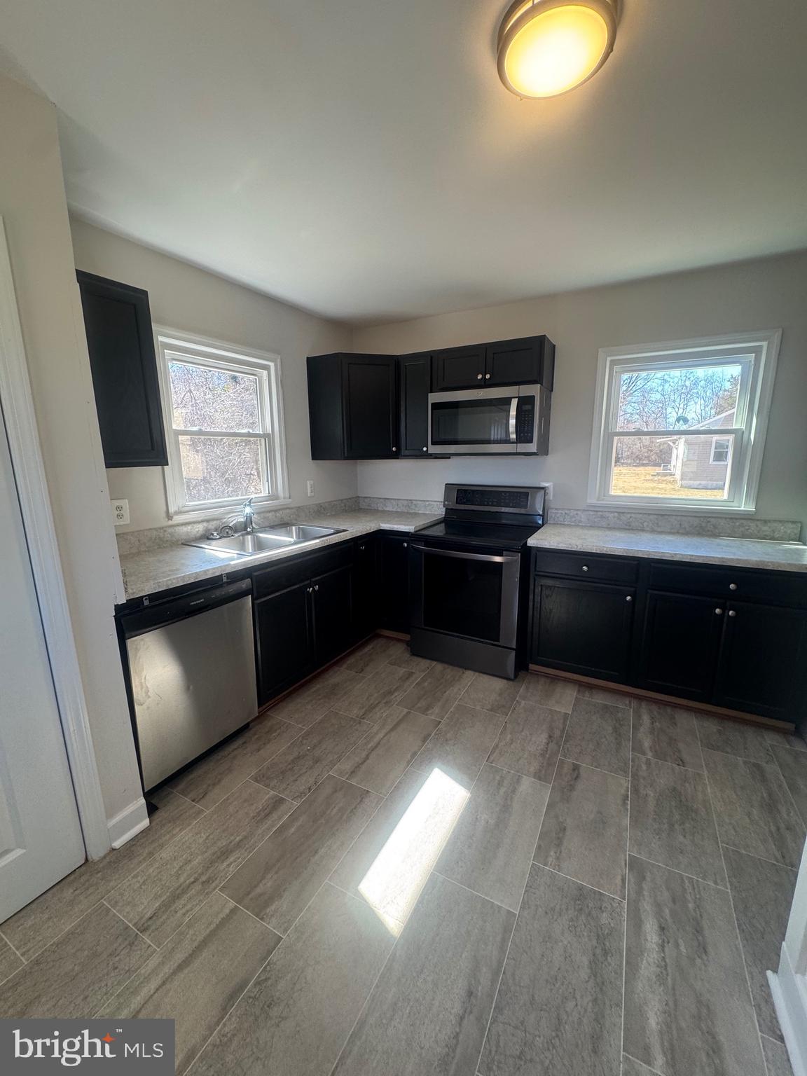 11360 Ridge Road King George, VA 22485 - Photo 20 of 39 a kitchen with stainless steel appliances granite countertop a sink and stove top oven