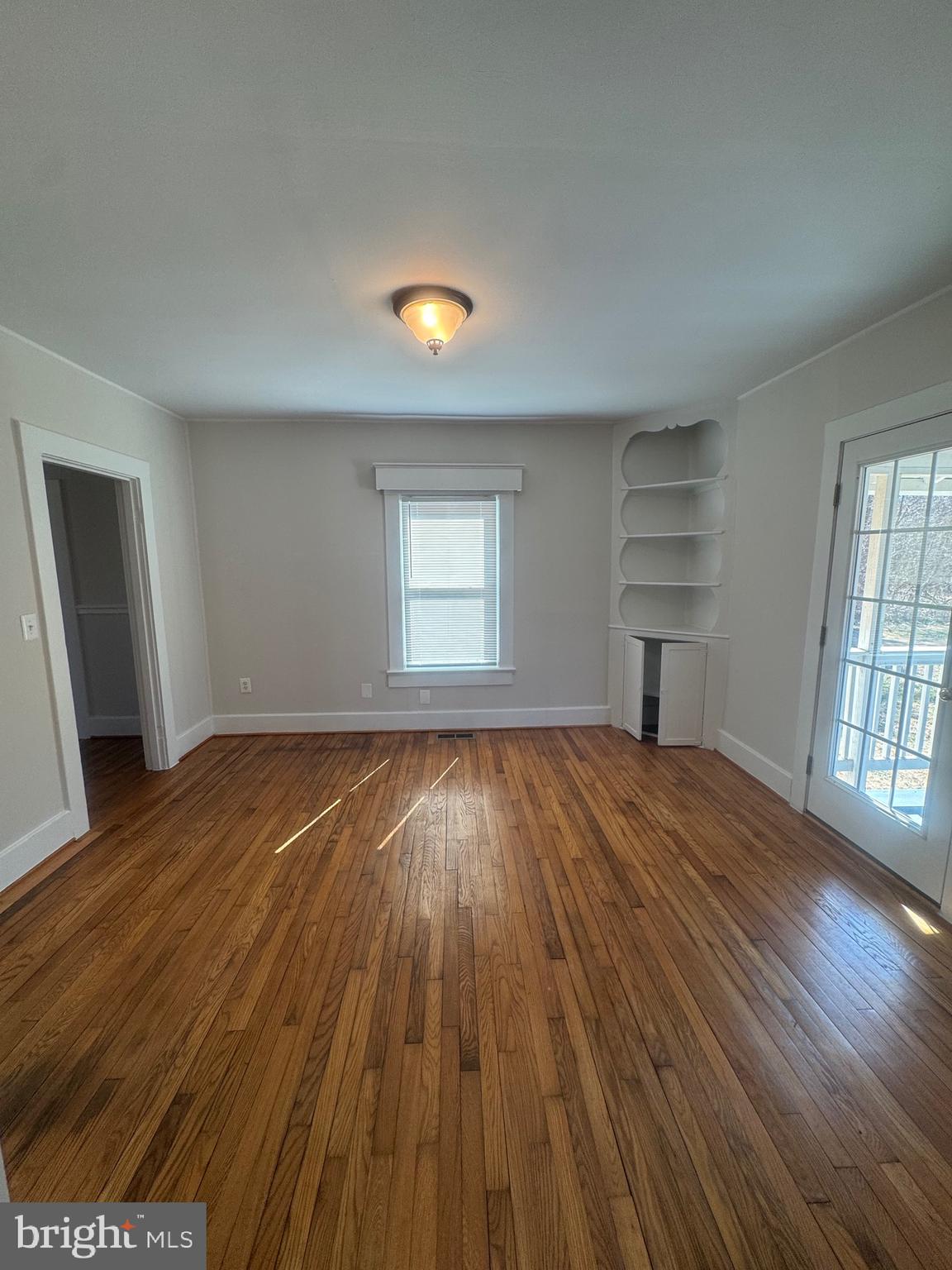 11360 Ridge Road King George, VA 22485 - Photo 26 of 39 an empty room with wooden floor and windows