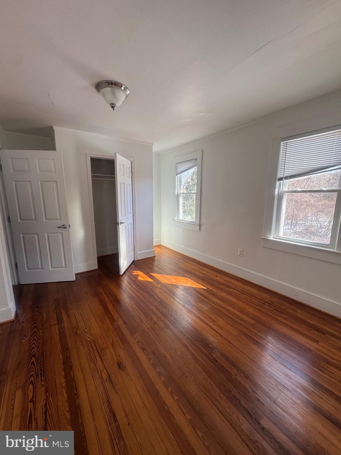11360 Ridge Road King George, VA 22485 - Photo 5 of 39 an empty room with wooden floor and windows