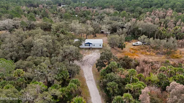 an aerial view of residential house with outdoor space