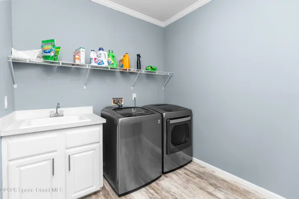 a utility room with dryer and washer