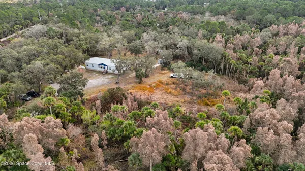 a backyard of a house with lots of green space
