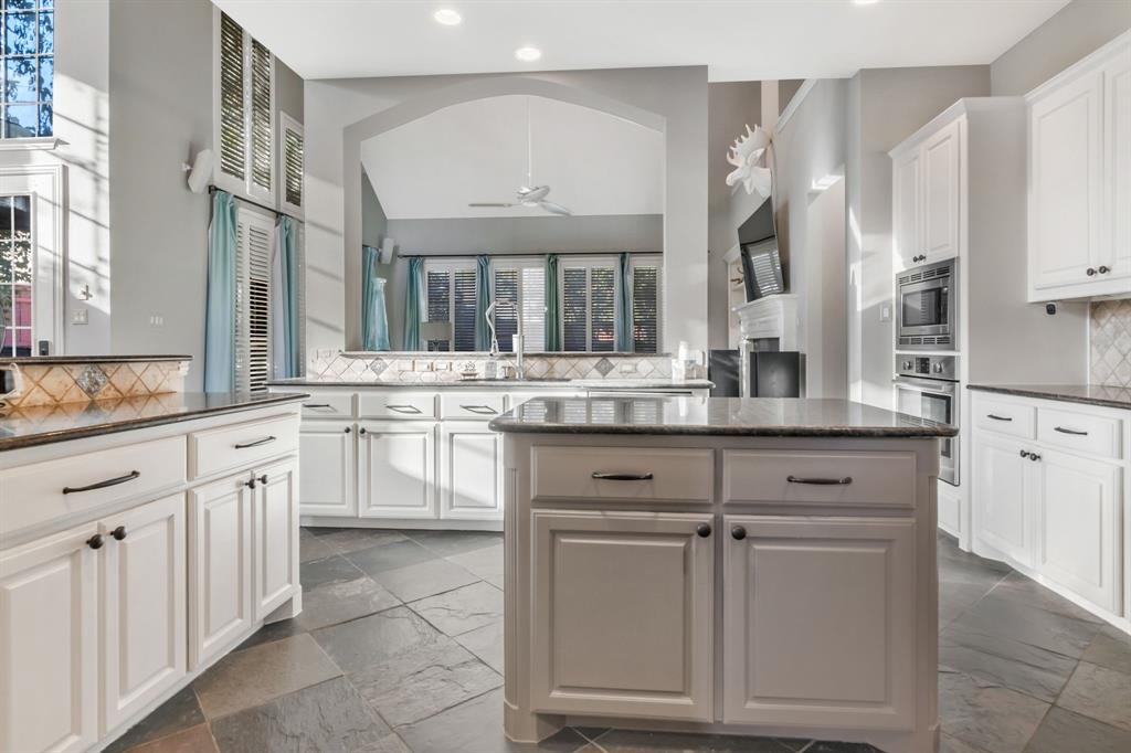 508 Cypress Court Keller, TX 76248 - Photo 13 of 40 a kitchen with cabinets appliances and a counter top