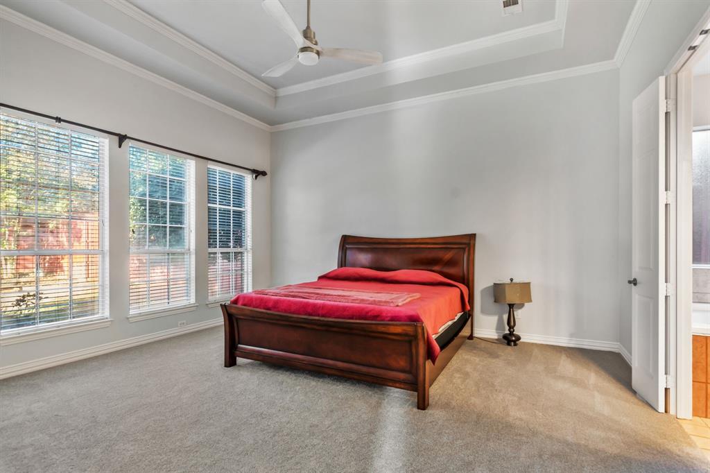 508 Cypress Court Keller, TX 76248 - Photo 19 of 40 a bedroom with a bed and a large window