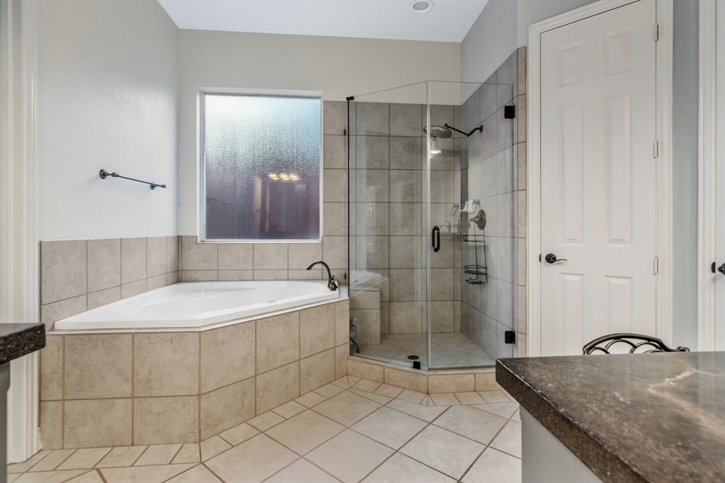 508 Cypress Court Keller, TX 76248 - Photo 22 of 40 a bathroom with a granite countertop bathtub shower and checkered floor