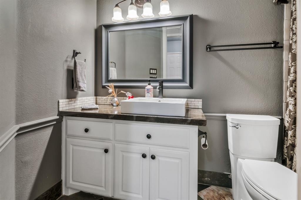 508 Cypress Court Keller, TX 76248 - Photo 25 of 40 a bathroom with a sink vanity mirror and toilet