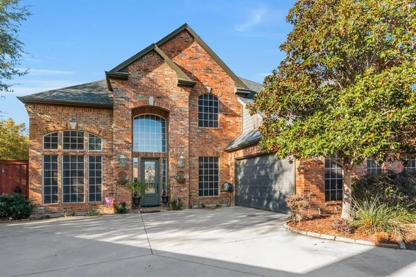 a front view of a house with a outdoor space