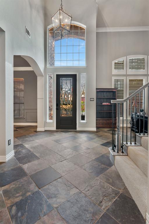 508 Cypress Court Keller, TX 76248 - Photo 5 of 40 a view of livingroom with fireplace and chandelier