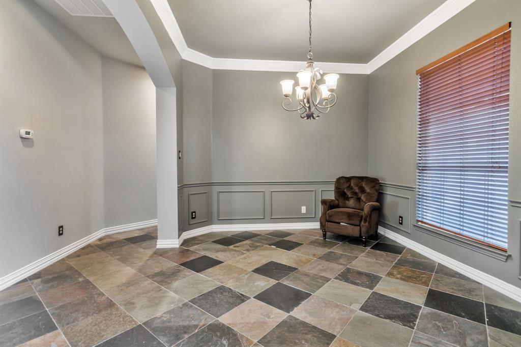 508 Cypress Court Keller, TX 76248 - Photo 6 of 40 a spacious bedroom with a bed and a chandelier