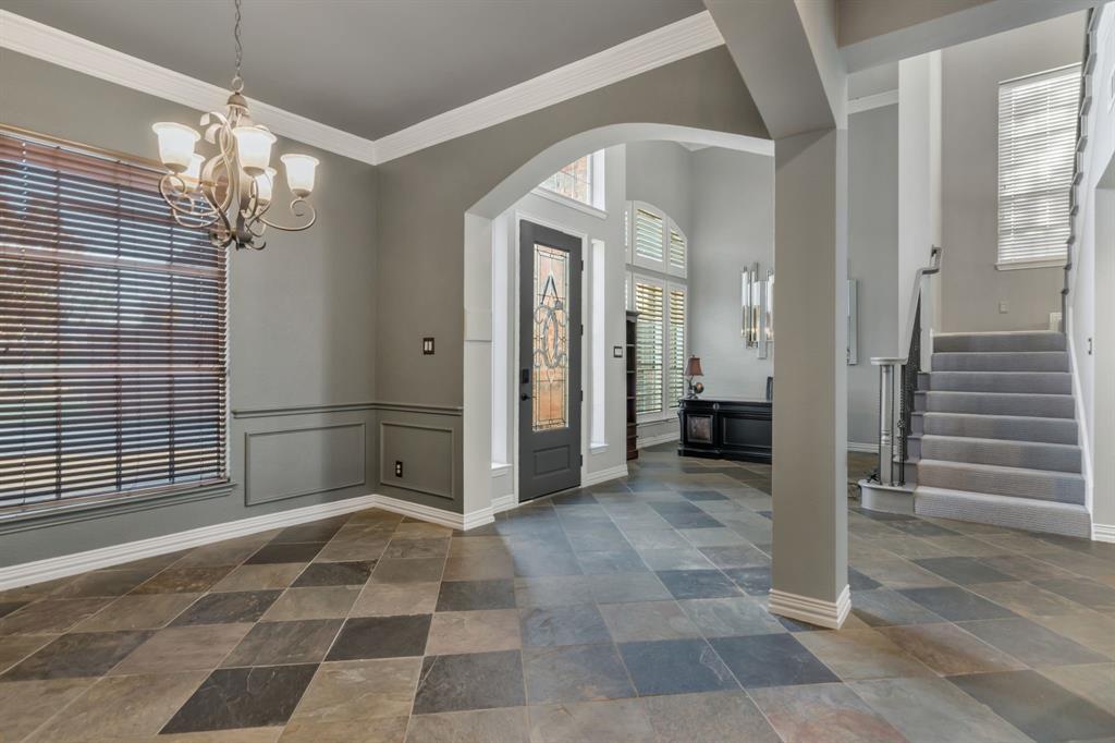 508 Cypress Court Keller, TX 76248 - Photo 7 of 40 a view of a hallway with entryway door and chandelier