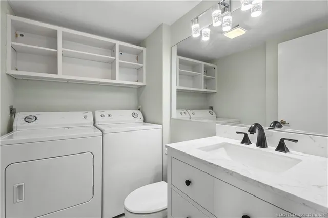 a kitchen with stainless steel appliances a refrigerator and a stove top oven