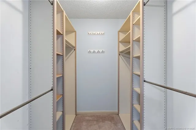 a bathroom with a double vanity sink a mirror and a shower