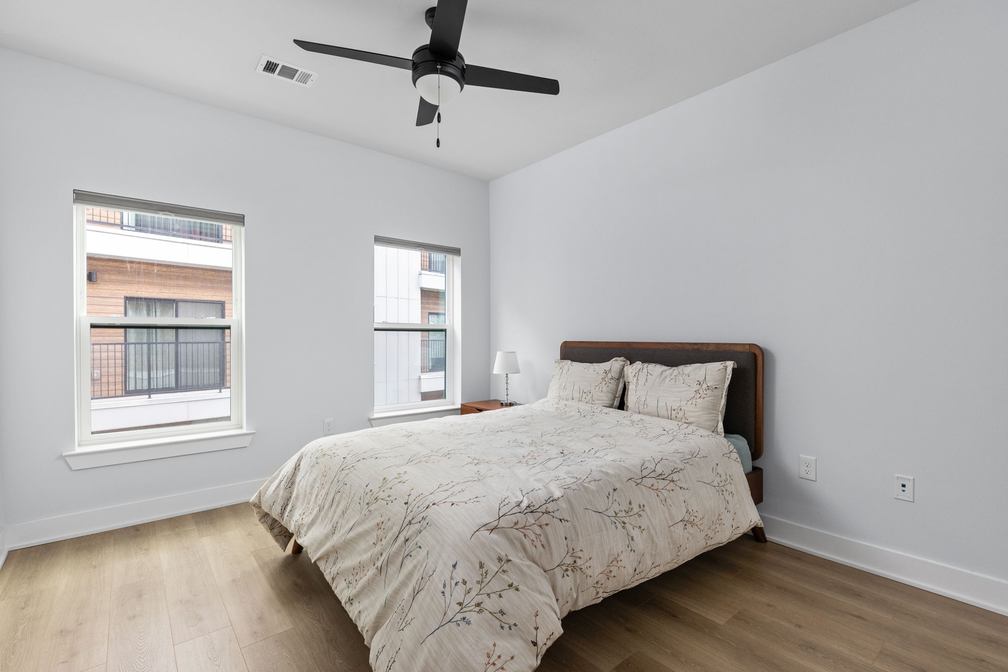 2500 Longview Street, Unit 405 Austin, TX 78705 - Photo 16 of 28 Bedroom featuring wood finished floors and ceiling fan